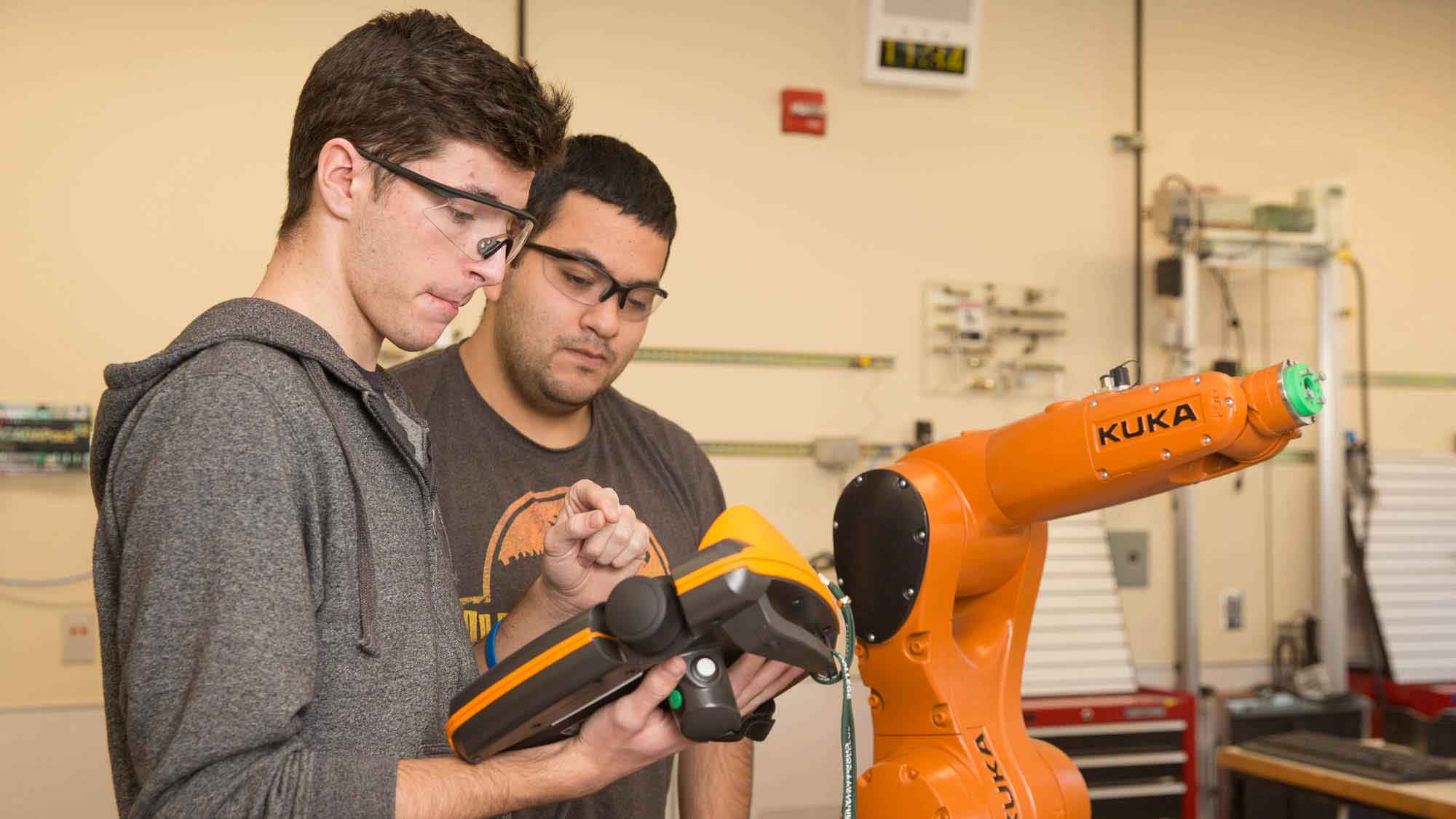 Students working on robotics project together